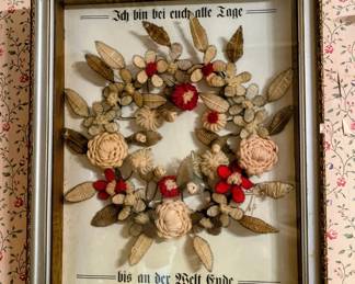 Antique shadowbox with German writing and floral arrangement in main house