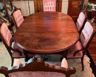 Dining room table with 4 leaves & 6 chairs in main house