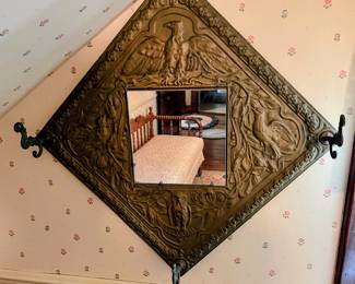 Antique mirror with hooks in main house