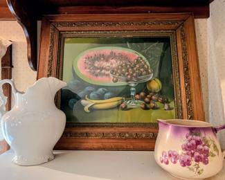 Antique framed print and pitchers in main house