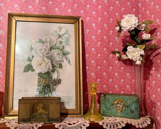 Vintage framed print and antique candy/chocolate tins in the main house