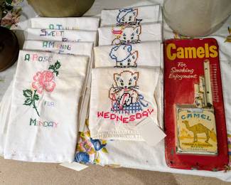 Camel cigarettes, metal, sign, and vintage tea towels in guest house