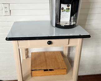 Enamel table in the main house. Keurig coffee maker in the guest house.