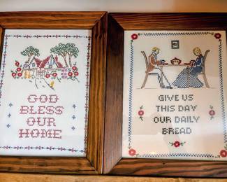 Vintage cross stitched framed pieces in the guest house
