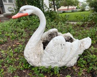 Concrete swan near garage