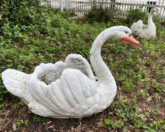 Second concrete swan near garage. Has had some damage. Please note.