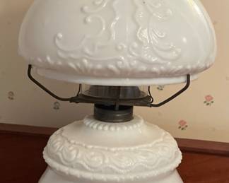 Milk, glass hurricane lamp in main house