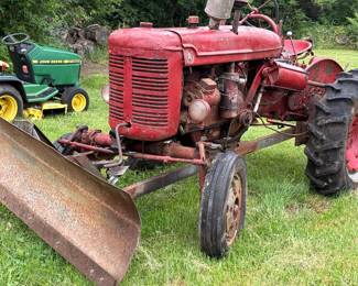 Farm all tractor with blade attachment 