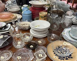 Various dishes, glassware, large antique table