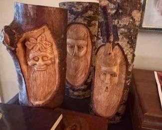 Close up details of hand carved faces and animals