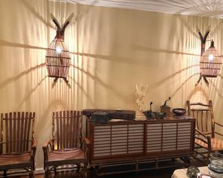 Ficks Reed credenza/server with sliding doors on faux bamboo carved legs with brass tips, c. 1950 w/ wall mounted lamps coordinated to credenza design also by Ficks Reed w/faux bamboo frames and rattan globes over lights
