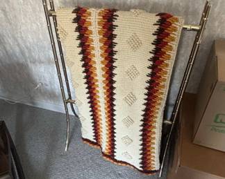 Vintage Brass Bamboo Style Magazine Rack with Geometric Crochet Blanket