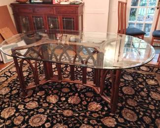 Rattan dining table with beveledglass top