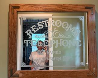 Vintage restrooms & telephone mirrored sign from a restaurant 