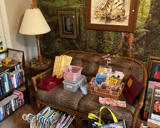 Jungle themed loveseat, hangers, wall, art, books