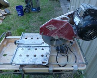 MK Diamond tile saw with diamond blade, fence, on stand with casters and water pump. These are the standard of the industry and this saw works.