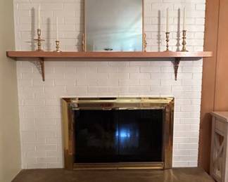 Ornate Arch Mirror with Brass Fireplace Screen and Candlesticks