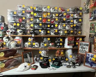 A WALL OF AUTOGRAPHED MINI HELMETS!