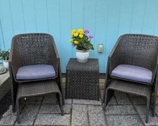 2 cozy patio chairs w/ foot rests. Comfy! Middle table for drinks or a plant.