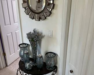 Mirror and black demi-lune table
