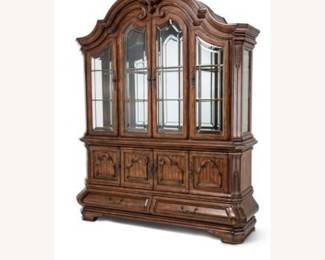 Michael Amini Tuscano China Cabinet featuring ornate hand-carved wood details and rustic biscotti finish.