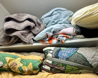 Tons of linens and several cool quilts