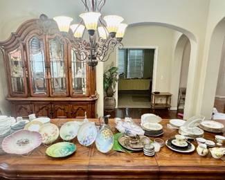 Mega dining table topped with a multitude of fine china