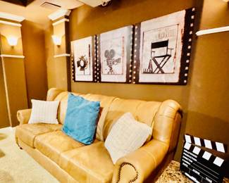 Movie room with sofa,  movie memorablia, directors cut