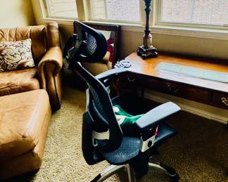 Desk and leather club chair with ottoman