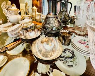 China cabinet full of gorgeous  table settings