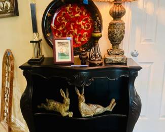 Gorgeous black display or book shelf ( almost a lacquer look) pair of lounging bunnies, soooo many candle sticks