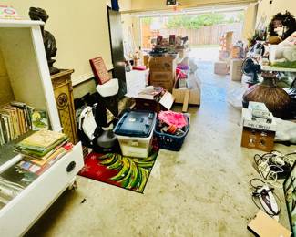 Garage stacked full with kids books, tools, decor