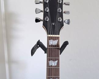 ESP LTD EC-256 Flamed Maple Single-Cut Electric Guitar A classic single-cutaway solid-body electric guitar by ESP LTD,