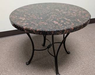 Marble table 23" D 20" tall black/reddish. Metal legs The white marble top table has wooden legs, 31.5Dx13.3/4" high