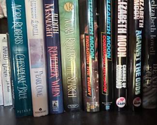 Collection of Romance and Science Fiction Novels by Nora Roberts, Elizabeth Lowell, Judith McNaught, Anne McCaffrey, Elizabeth Moon, and Jayne Ann Krentz