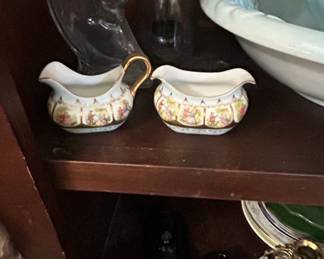 Pair of Porcelain Creamers with Pastoral Scenes
