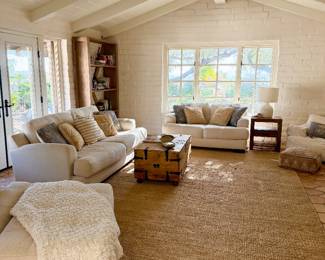 an oversize chair, a loveseat & a 3-seater sofa, giant jute rug & handmade Mexican coffee table with 3 compartments