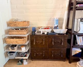 An entire office! Printer, office supplies, book shelves, desk, decor, lamps