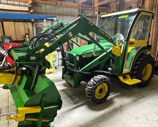 John Deere 4300 ST;  rear camera; 722.7 hours; back blade; bucket; snow blower; bucket