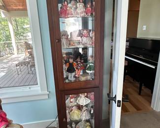 Collectible dolls and glass front display case