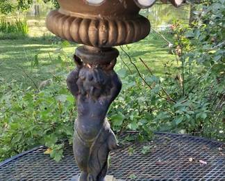 Cast iron cherub statue