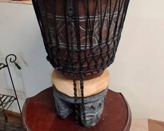 hand-carved Indonesian djembe drum featuring a dragon motif and rope tuning.