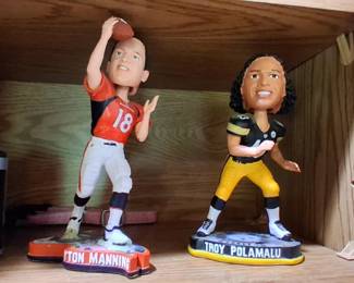 FOCO branded Troy Polamalu NFL bobblehead figure featuring his iconic long hair and Steelers uniform.