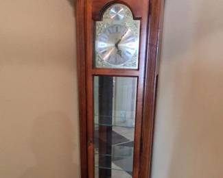 Howard Miller grandfather clock with shelves