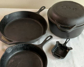 Lot 61: Cast iron cookware set with Lodge skillets, Lodge Dutch oven, and Griswold ash tray