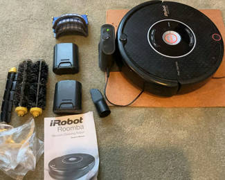 Lot 15: iRobot Roomba vacuum cleaning robot with docking station and accessories