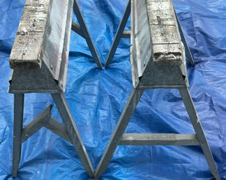 Lot 155: Two wooden-top metal sawhorses with hardware