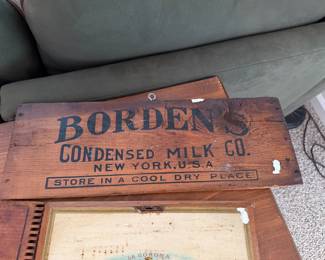 vintage Borden's Condensed Milk Co. wooden crate panel features bold black lettering advertising the company from New York