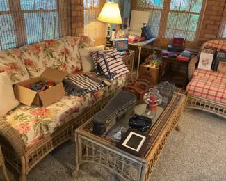 Wicker coffee table, couch, and chair.