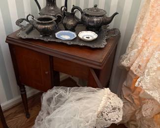 Vintage sewing cabinet and sewing machine, vintage wedding veil and silver-plated tea set